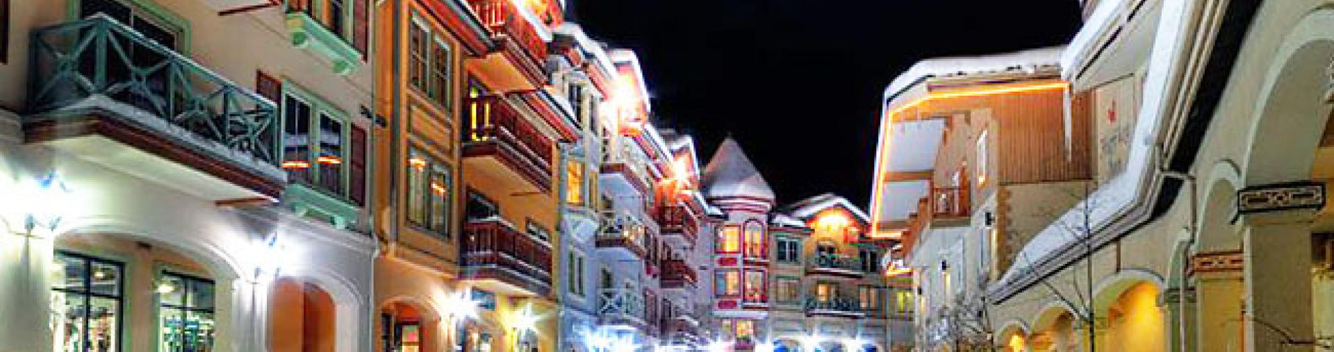 A snow-covered street at night