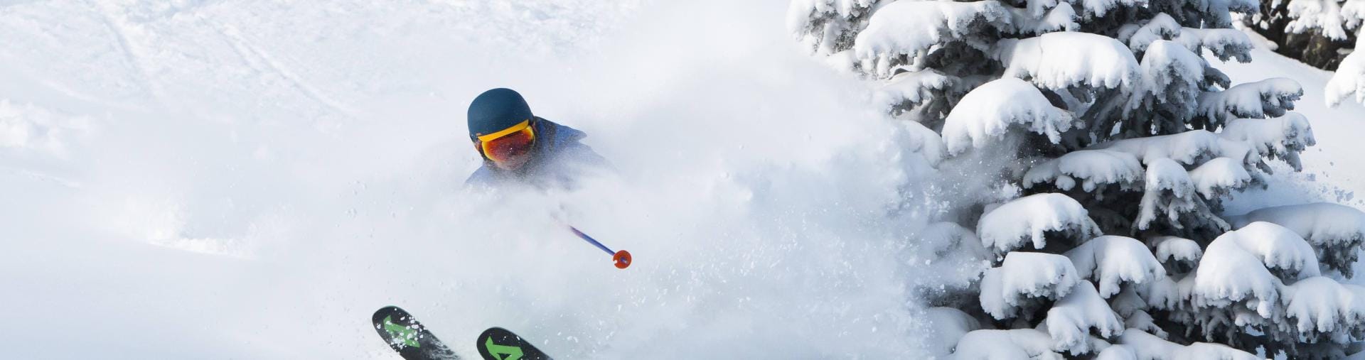 skier mid run on a snow covered hill