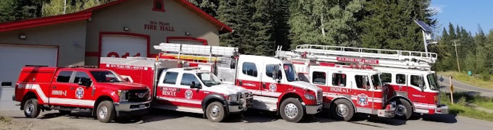 Fire trucks lined in front of fire hall