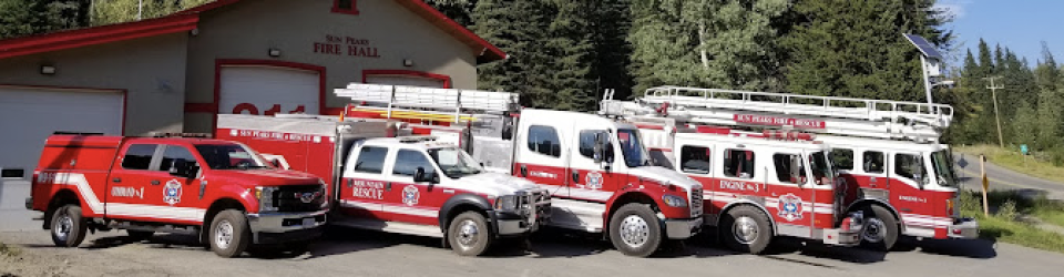 Fire trucks lined in front of fire hall